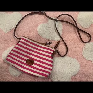 Pink and white dooney and bourke purse.